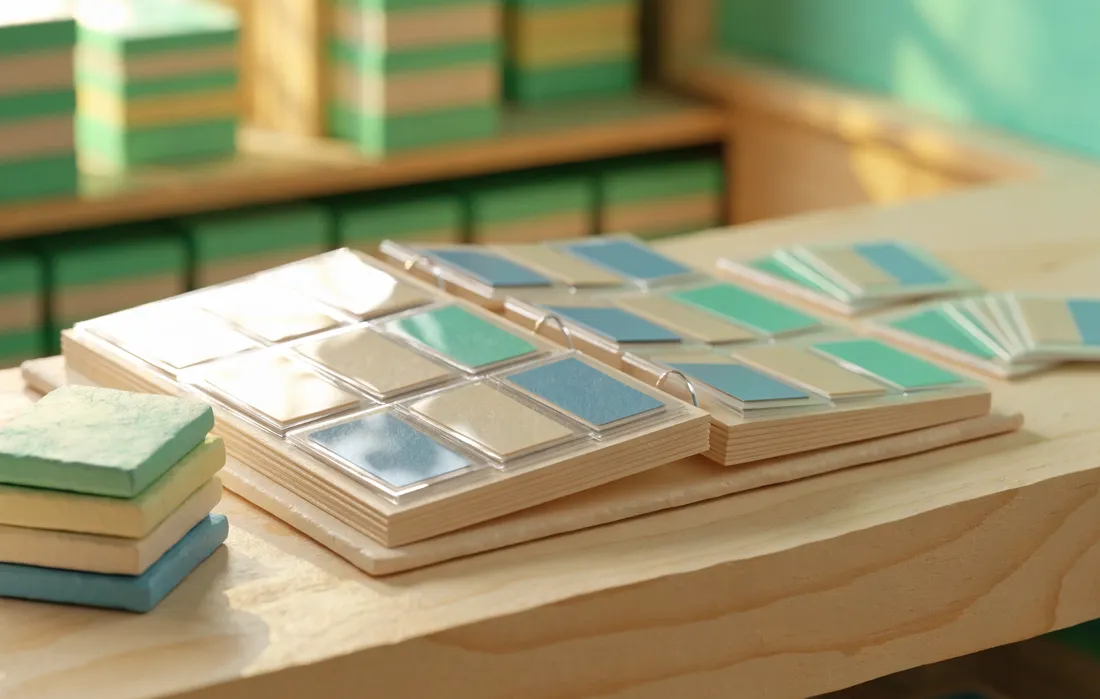 A miniature binder of sleeved cards open on a shop counter, stock shelves behind it